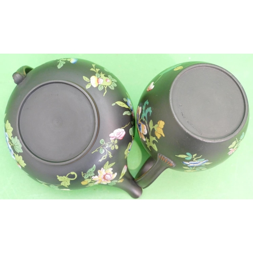 122 - 2 x Wedgwood Basalt Round Bulbous Shaped Teapots on black ground with multicoloured enamelled floral... 