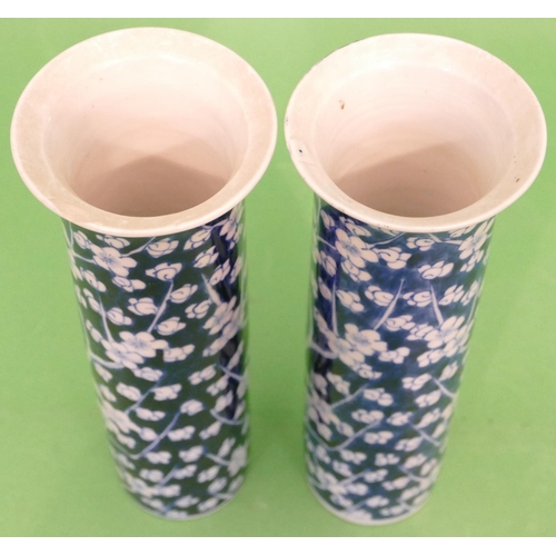 132 - A Pair of Blue and White Cylindrical Trumpet Shaped Oriental Vases on blue and white ground having b... 