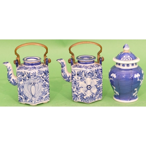 135 - A Pair of Oriental Blue and White Small Hexagonal Shaped Teapots with covers having metal swing over... 