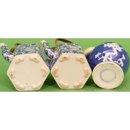 135 - A Pair of Oriental Blue and White Small Hexagonal Shaped Teapots with covers having metal swing over... 