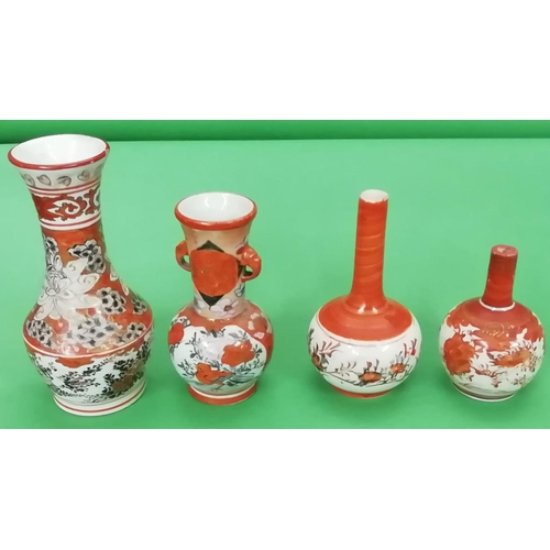 139 - An Oriental Small Round Bulbous Thin Necked Trumpet Shaped Vase on white and red ground having flora... 