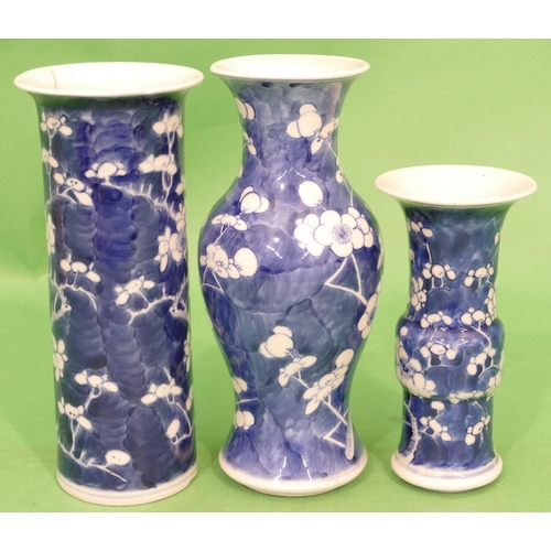 144 - An Oriental Blue and White Round Bulbous Thin Necked Trumpet Shaped Vase having branch and blossom d... 