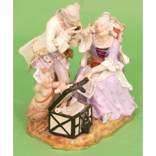 15 - A Meissen Group of seated elderly lady with gentleman and cupid standing next to open trunk (sword t... 