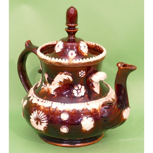 16 - A 19th Century Glazed Earthenware Round Bulbous Shaped Barge Teapot having raised bird, floral and s... 