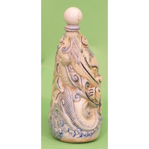 19 - An Oriental Glazed Earthenware Flask in form of a dragon on white and blue ground with stopper, 23.5... 