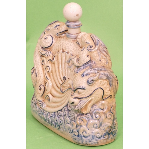 19 - An Oriental Glazed Earthenware Flask in form of a dragon on white and blue ground with stopper, 23.5... 