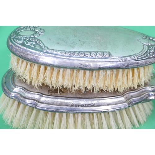 220 - An 800 Silver Coloured Metal Hairbrush having embossed fruit, ribbon, swag and leaf decoration, also... 