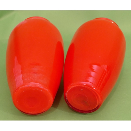 23 - A Pair of Red Glass Round Bulbous Thin Necked trumpet Shaped Vases, 27cm high.