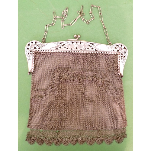 233 - A Continental Ladies Mesh Evening Purse having pierced floral and scroll decoration with chain, 17.7... 