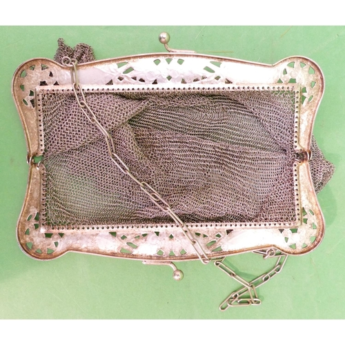 233 - A Continental Ladies Mesh Evening Purse having pierced floral and scroll decoration with chain, 17.7... 