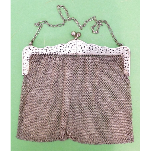 237 - A 925 Silver Ladies Mesh Evening Purse having double hinged top, with pierced floral and leaf decora... 