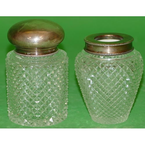 267 - A Continental Cut Glass Cylindrical Dressing Table Bottle having silver coloured metal lid, 10cm hig... 