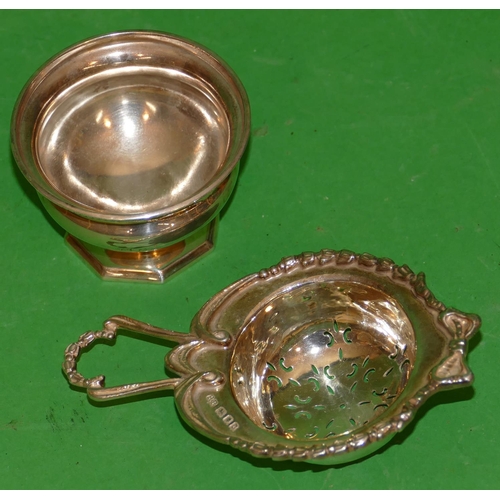 269 - A London Silver Tea Strainer having raised ribbon and leaf rim with Birmingham silver round bulbous ... 