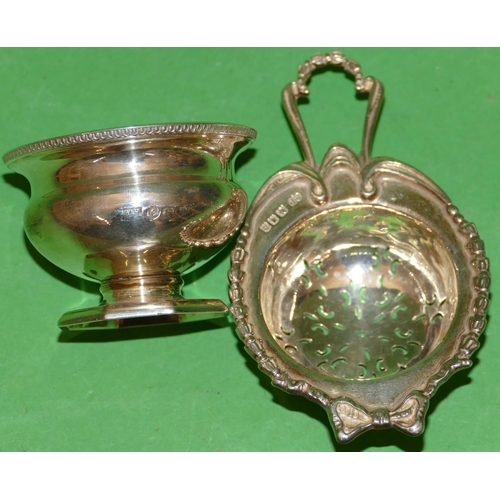 269 - A London Silver Tea Strainer having raised ribbon and leaf rim with Birmingham silver round bulbous ... 