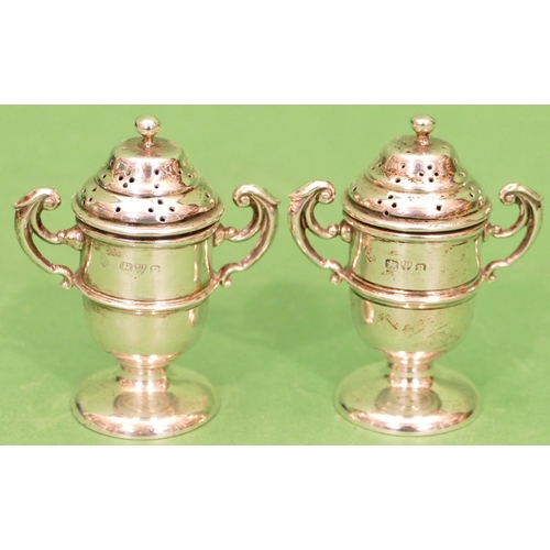 290 - A Pair of Late Victorian 2 Handled Trophy Shaped Pepper Pots on round bases, Chester 1900, 7cm high,... 