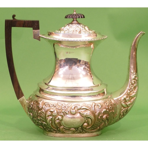 294 - An Edward VII Rectangular Bulbous Silver Teapot having part embossed flora, leaf and scroll decorati... 