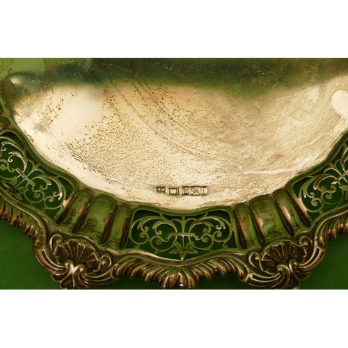 295 - A Victorian Silver Card Tray having gadroon shell and pierced rim on bun feet, Sheffield 1898, maker... 