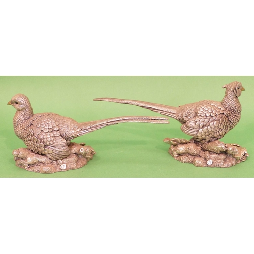 311 - A Pair of Sterling Silver Covered Figures of birds circa 1995, 19.5cm long, 10cm high.