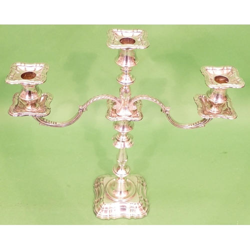 312 - A George VI Silver 2 Branch 3 Light Candelabra having scroll shaped arms, turned stem on square scal... 