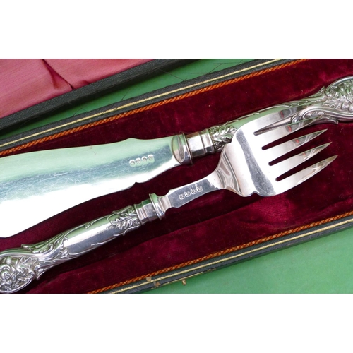 328 - A Pair of Sheffield Silver Handled Silver Plated Fish Servers having embossed thistle, floral, leaf ... 