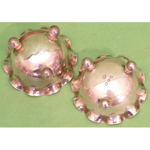 329 - A Pair of Chester Silver Round Bulbous Trumpet Shaped Salts having crinkled rims on ball feet, with ... 