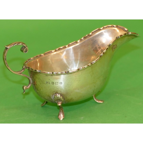 349 - A Birmingham Silver Sauce Boat having crinkled rim, scroll handle on splayed feet, 3.4oz.