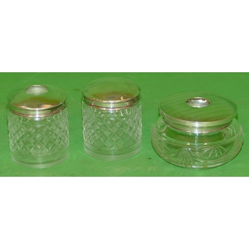 357 - A Pair of Cut Glass Round Dressing Table Pots having London silver tops, also another cut glass dres... 