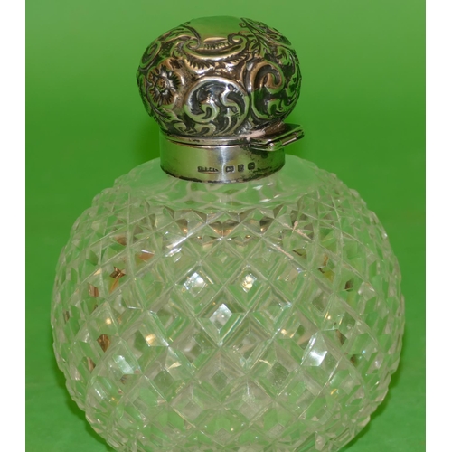 358 - A Victorian Round Bulbous Cut Glass Scent Bottle having tooth cut decoration, having silver neck and... 