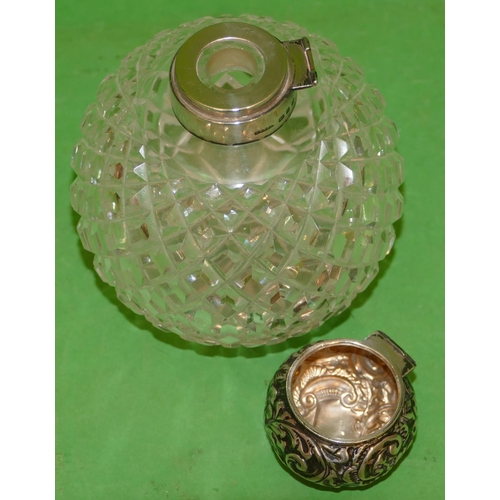 358 - A Victorian Round Bulbous Cut Glass Scent Bottle having tooth cut decoration, having silver neck and... 