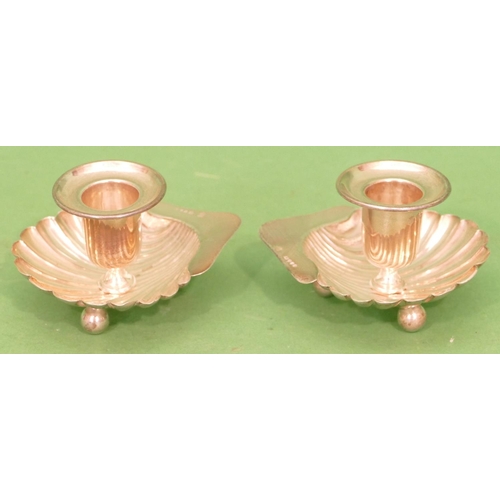 386 - A Pair of Victorian Silver Chamber Candlesticks on shell shaped bowls with bun feet, London 1886, ma... 