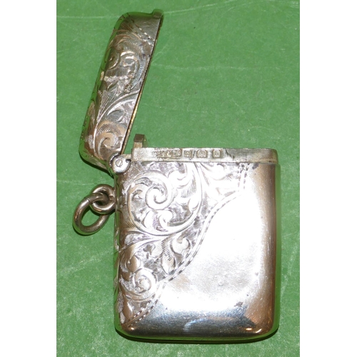 393 - An Edward VII Silver Vesta Case having part chased leaf and scroll decoration, hinge lid, Birmingham... 