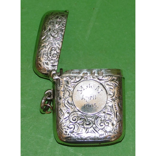 397 - A Victorian Silver Vesta Case having all over chased, leaf and scroll decoration, hinge lid, Birming... 