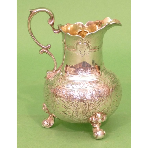 407 - A Victorian Silver Round Bulbous Cream Jug having scroll handle, all over leaf and floral decoration... 