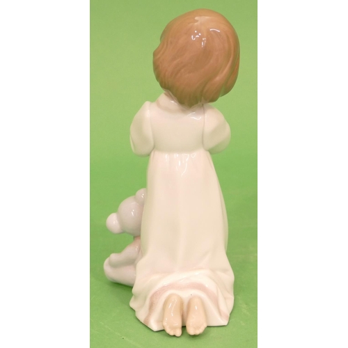 42 - A Lladro Figure of a young kneeling girl praying with teddy bear, 18cm high.