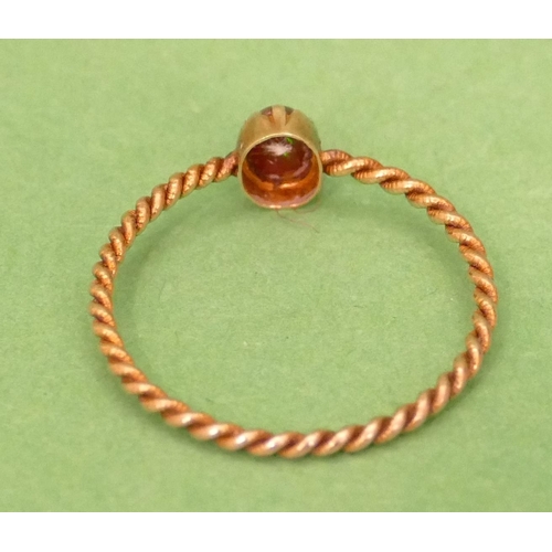 429 - A Small Gold Twist Ring set with red stone (stone chipped) size M/N.