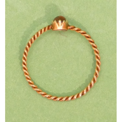 429 - A Small Gold Twist Ring set with red stone (stone chipped) size M/N.