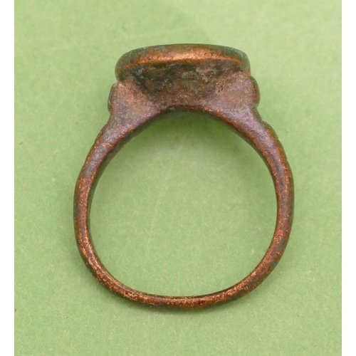 455 - A Roman Style Bronze Ring having animal motif, size P/Q.