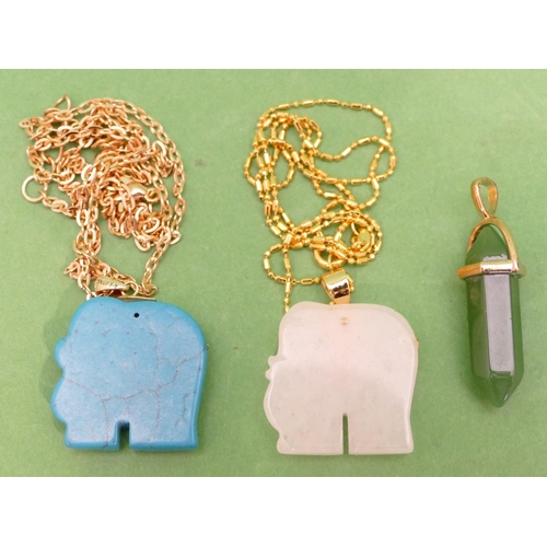 458 - A Turquoise Pendant in form of an elephant with chain, another similar pendant with chain and a jade... 