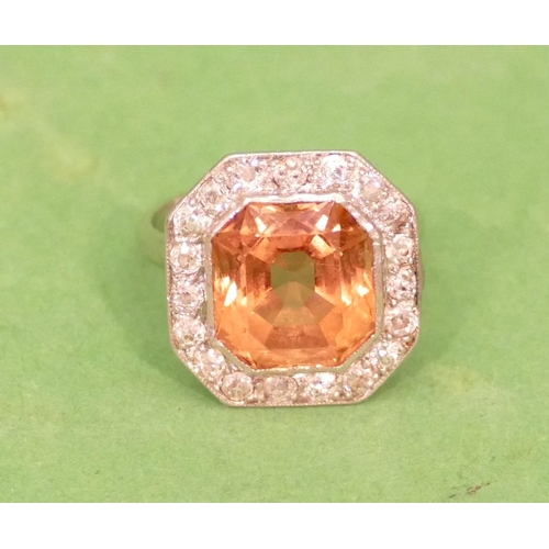 463 - A Platinum Orange Tourmaline Ladies Cluster Ring surrounded by 19 diamonds, size L (tourmaline 1.1cm... 