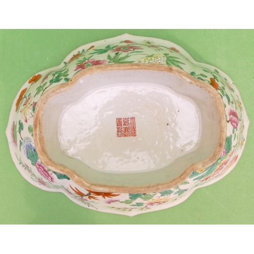 47 - A Jiaqing Chinese Oval Scallop Shaped Bowl having multicoloured fish, floral, leaf and branch decora... 