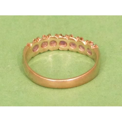 523 - A 9ct Gold Half Eternity Ladies Ring, set with garnets, size O/P.