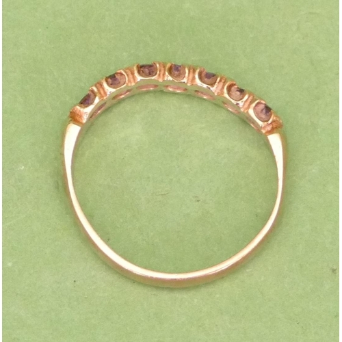 523 - A 9ct Gold Half Eternity Ladies Ring, set with garnets, size O/P.