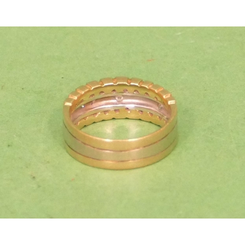 527 - An 18ct 2 Coloured Gold Ring set with 3 small diamonds, size O/P, 6.8g gross.