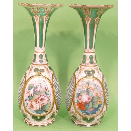 55 - A Pair of Bohemian Green Glass and White Enamelled Round Bulbous Thin Necked Trumpet Shaped Vases ha... 