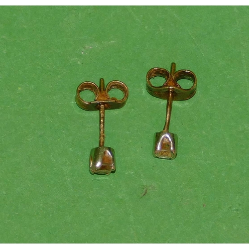 554 - A Pair of Small 9ct Gold Solitaire Diamond Earrings, approximately 0.10ct each.