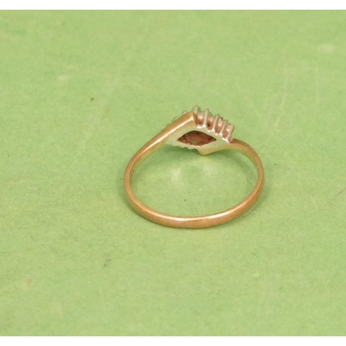 569 - A 9ct Gold Ladies Twist Ring with triangular style centre, inset with small diamonds, size M/N.