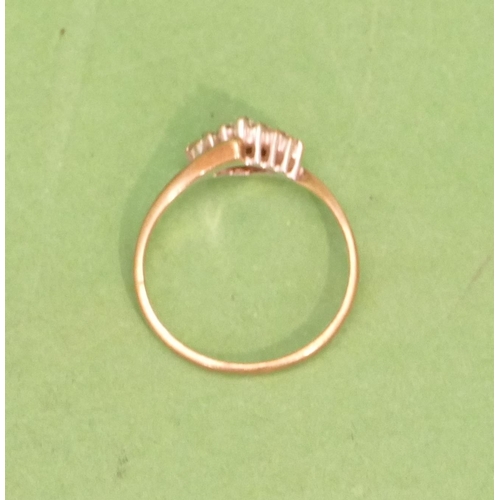 569 - A 9ct Gold Ladies Twist Ring with triangular style centre, inset with small diamonds, size M/N.