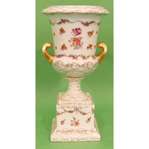 59 - A Continental China 2 Handled Urn Shaped Vase on square platform base, white ground with multicolour... 