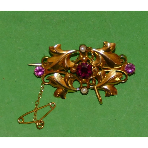 616 - A 9ct Gold Scallop Shaped Brooch having raised leaf decoration, mounted with 3 pink stones and half ... 