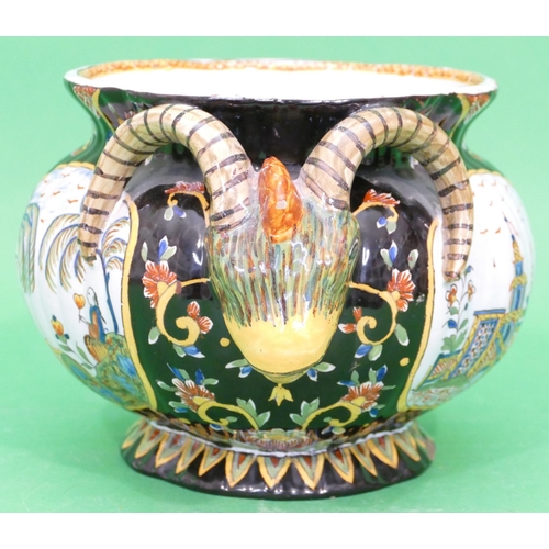 81 - A Continental Glazed Majolica Round Bulbous Thin Necked Trumpet Shaped Jardiniere having raised anim... 